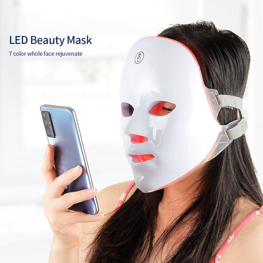 Woman wearing an LED beauty mask